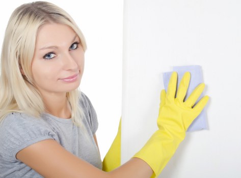 Professional carpet cleaner treating a stain